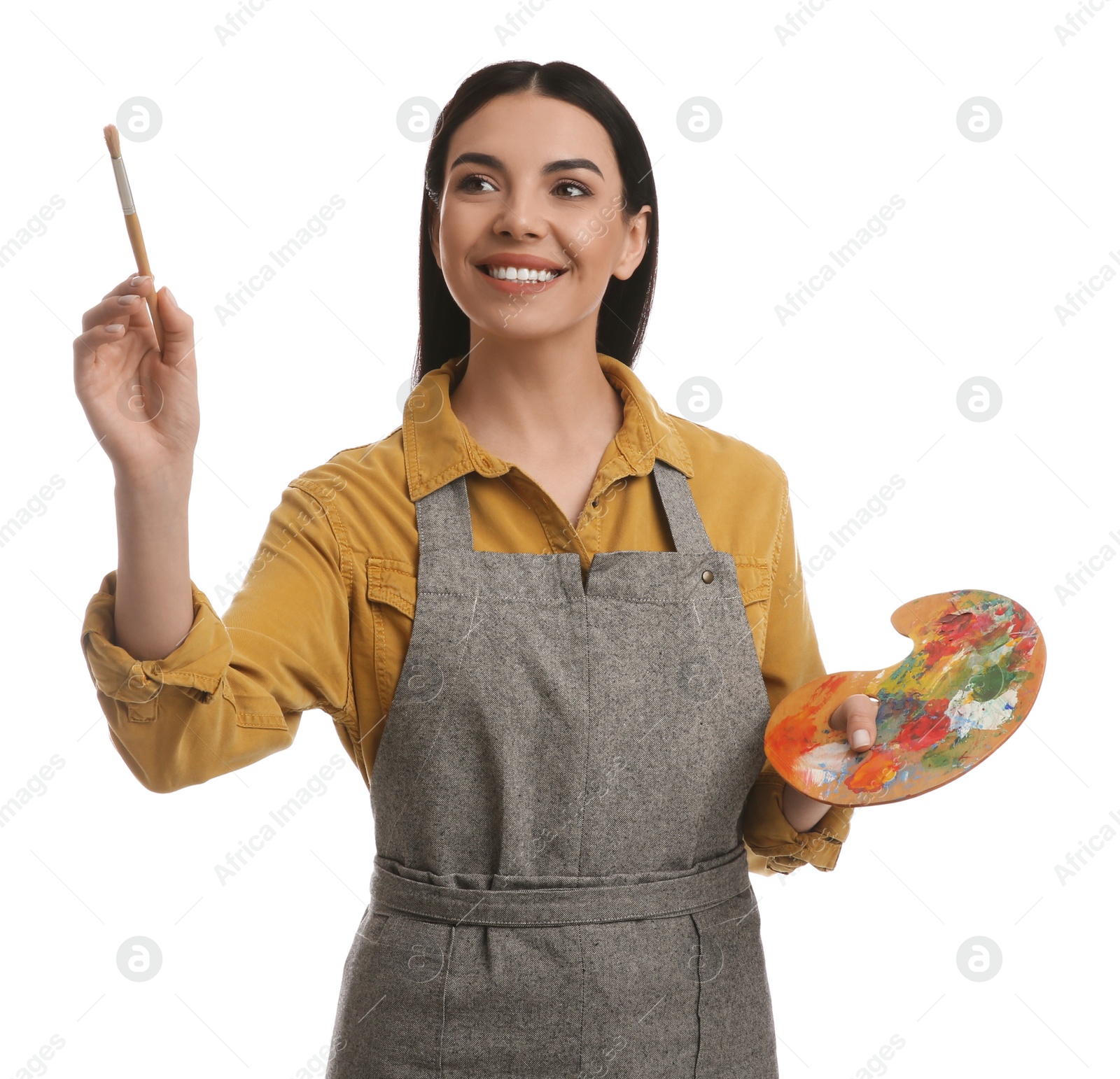 Photo of Young woman drawing with brush on white background