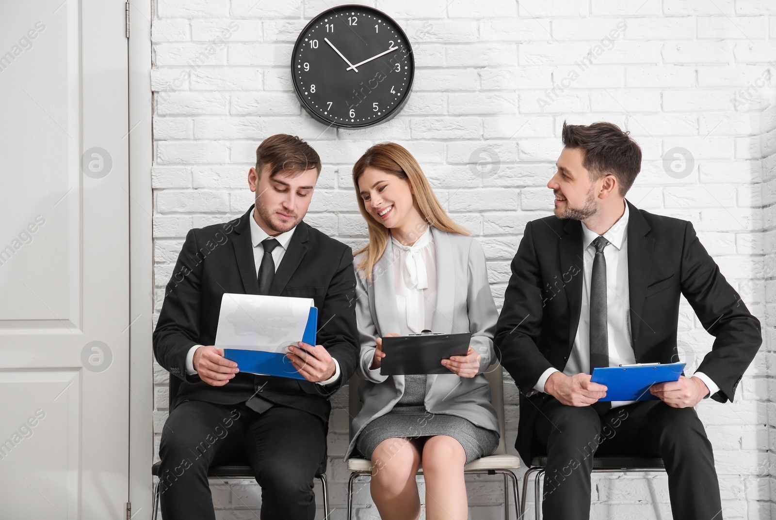 Photo of Group of people waiting for job interview, indoors