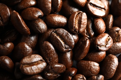 Photo of Roasted coffee beans as background, top view