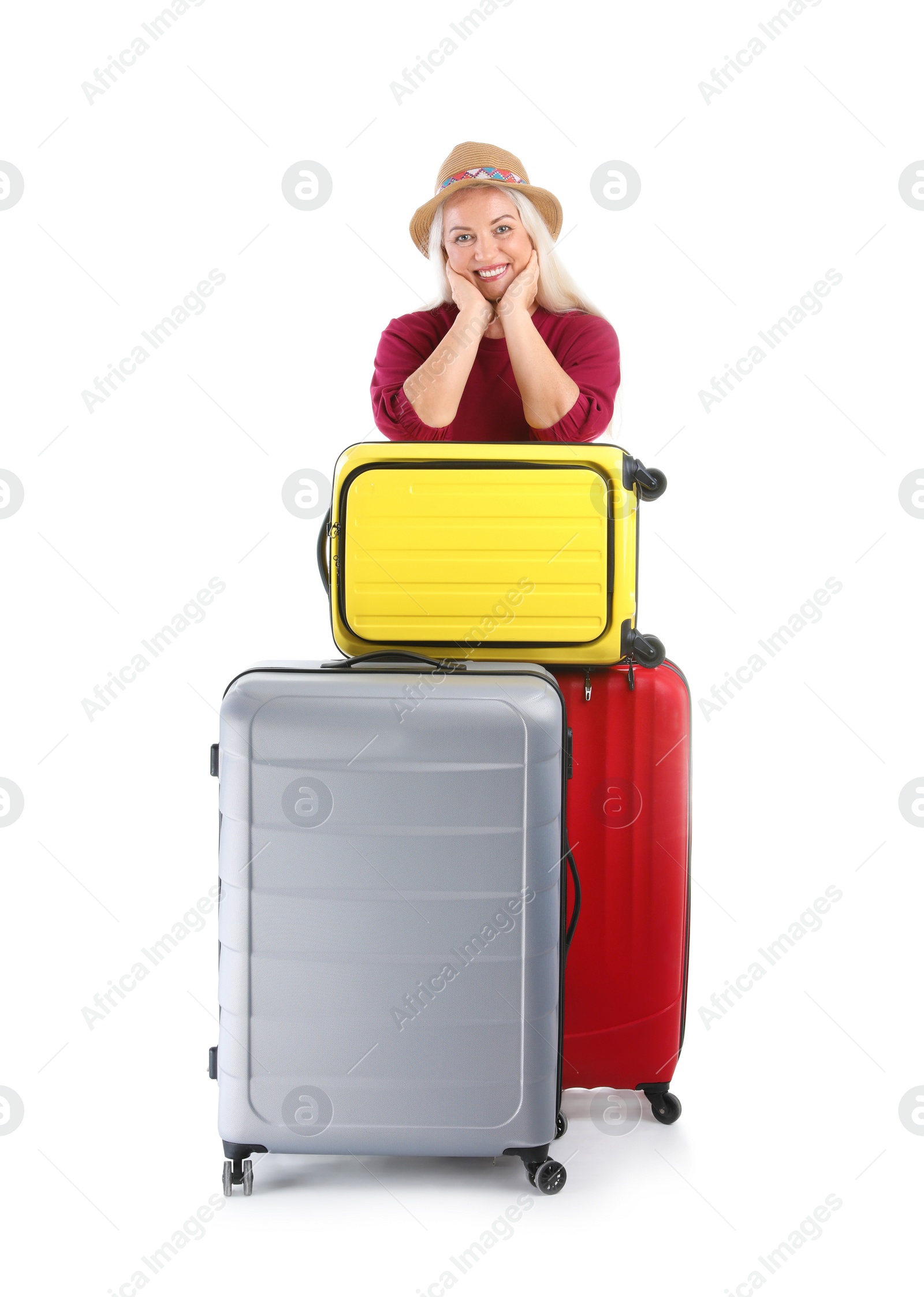 Photo of Senior woman with suitcases on white background. Vacation travel