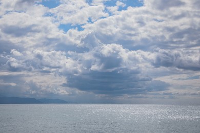 Photo of Picturesque view of sea under beautiful sky with fluffy clouds