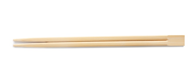 Chopsticks made of bamboo on white background, top view