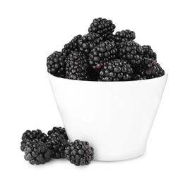 Photo of Fresh ripe blackberries in bowl isolated on white