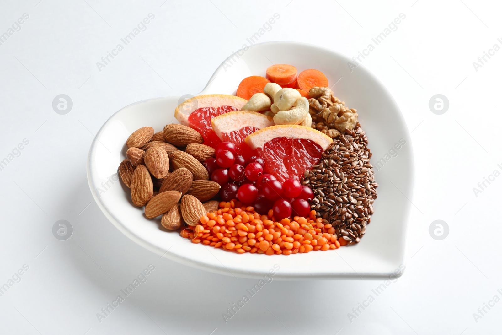 Photo of Plate with products for heart-healthy diet on white background