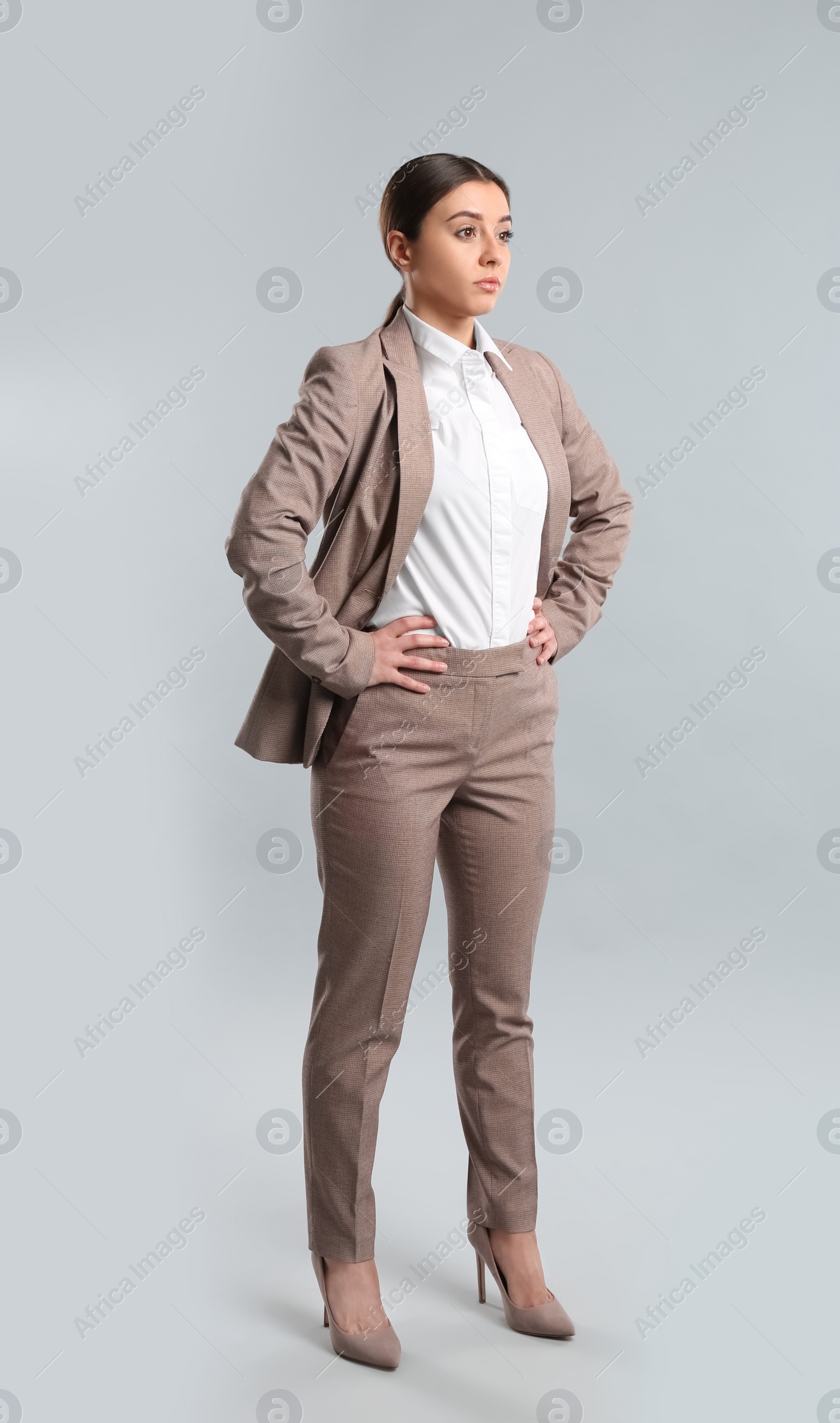 Photo of Full length portrait of young woman on white background