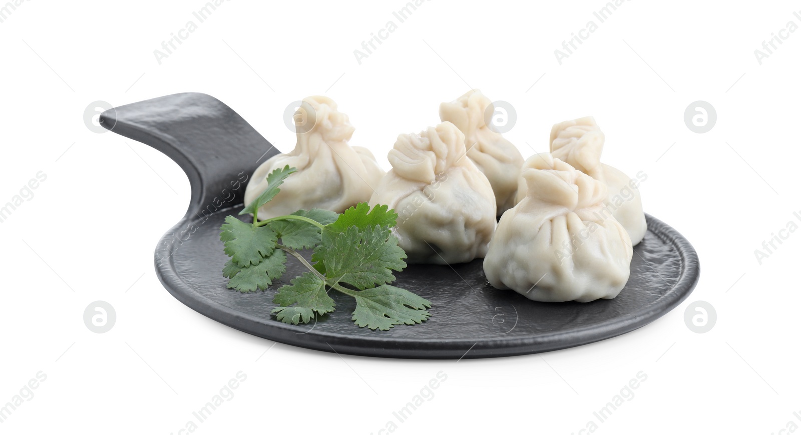 Photo of Serving board with tasty fresh khinkali (dumplings) and parsley isolated on white. Georgian cuisine