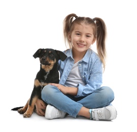 Little girl with cute puppy on white background