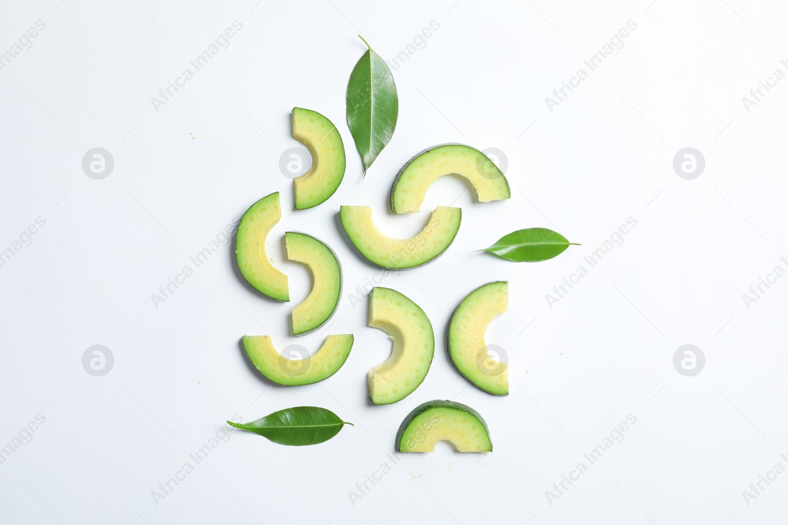 Photo of Composition with sliced ripe avocado on white background