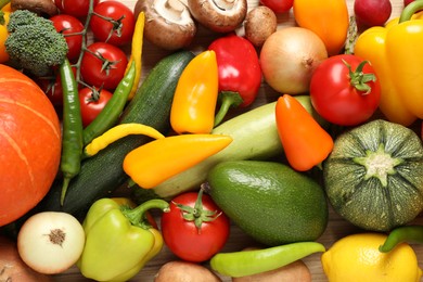 Photo of Different fresh vegetables as background, top view