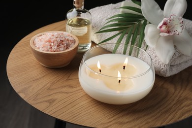 Photo of Composition with different spa products and orchid flower on wooden table