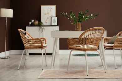 Photo of Beautiful dining room interior with new stylish furniture