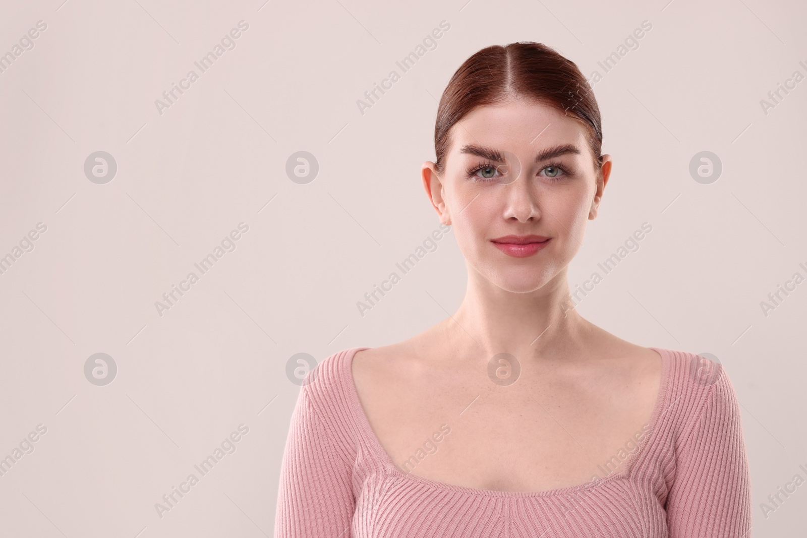 Photo of Portrait of beautiful woman on light background. Space for text