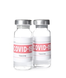 Photo of Vials with vaccine against coronavirus on white background