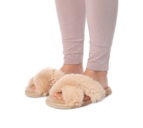 Woman in beige fluffy slippers on white background, closeup