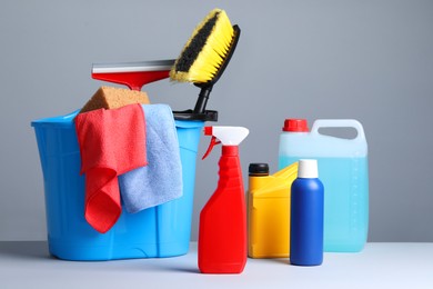 Photo of Different car products in bucket on white background