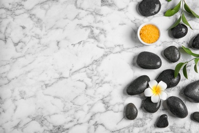 Flat lay composition with spa stones and space for text on marble background