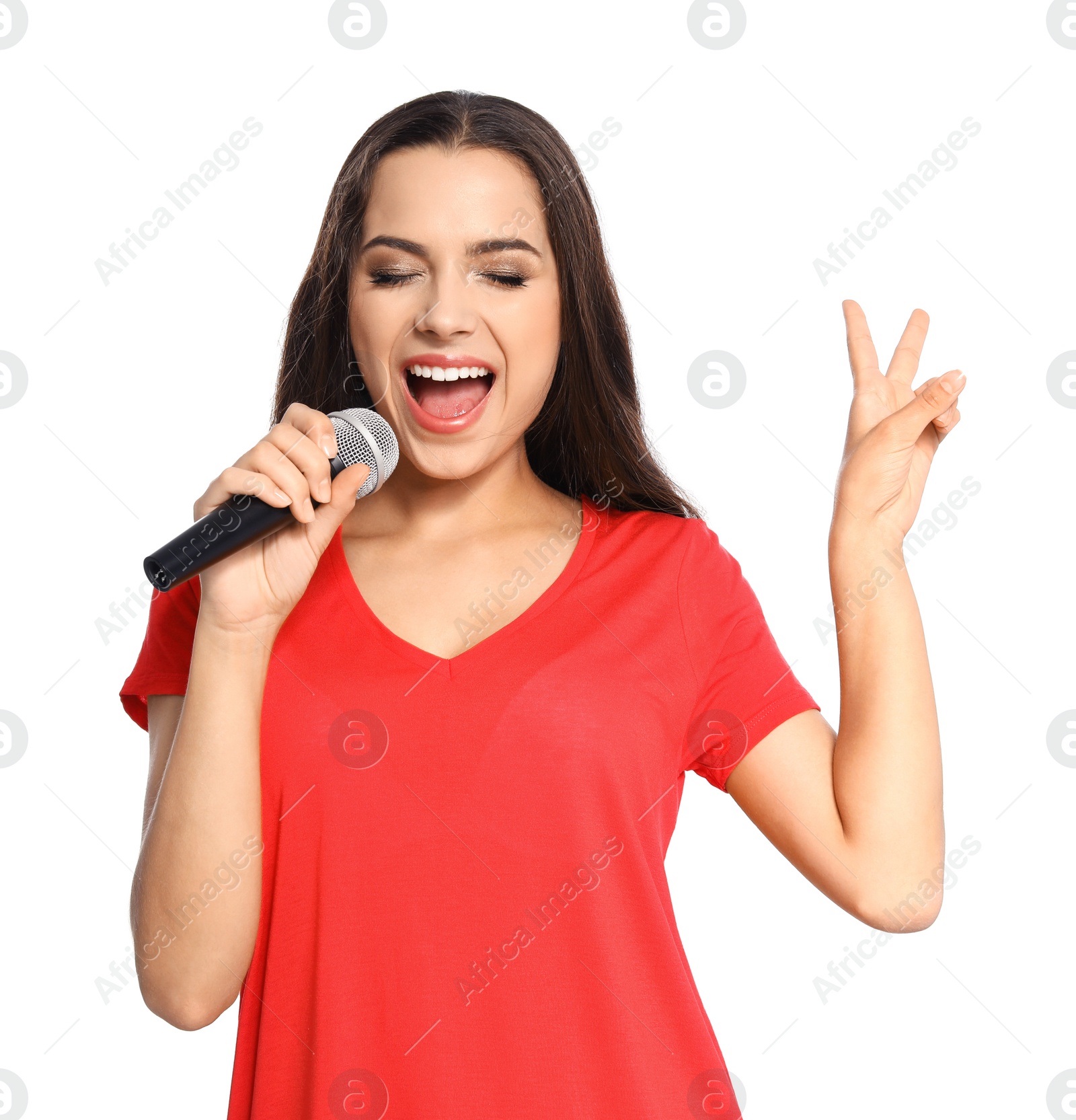 Photo of Young woman singing into microphone on white background. Christmas music