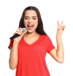 Young woman singing into microphone on white background. Christmas music