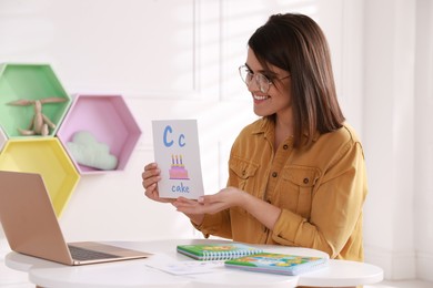 Photo of Happy English teacher giving online lesson. Early childhood education