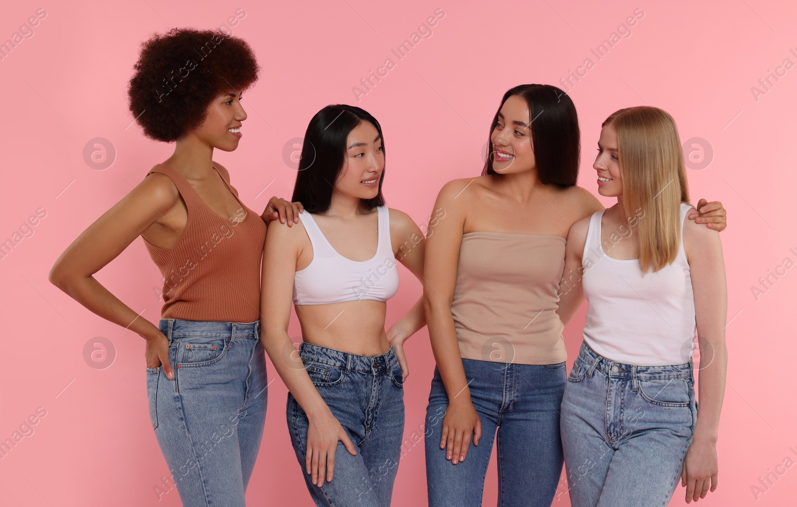 Photo of Portrait of beautiful young women on pink background