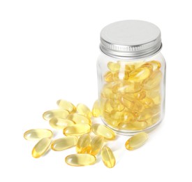 Photo of Bottle and pile of softgel capsules isolated on white