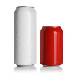 Photo of Aluminum cans with drinks on white background