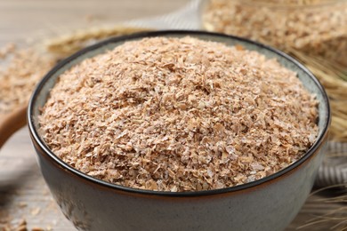 Dry wheat bran in bowl, closeup view