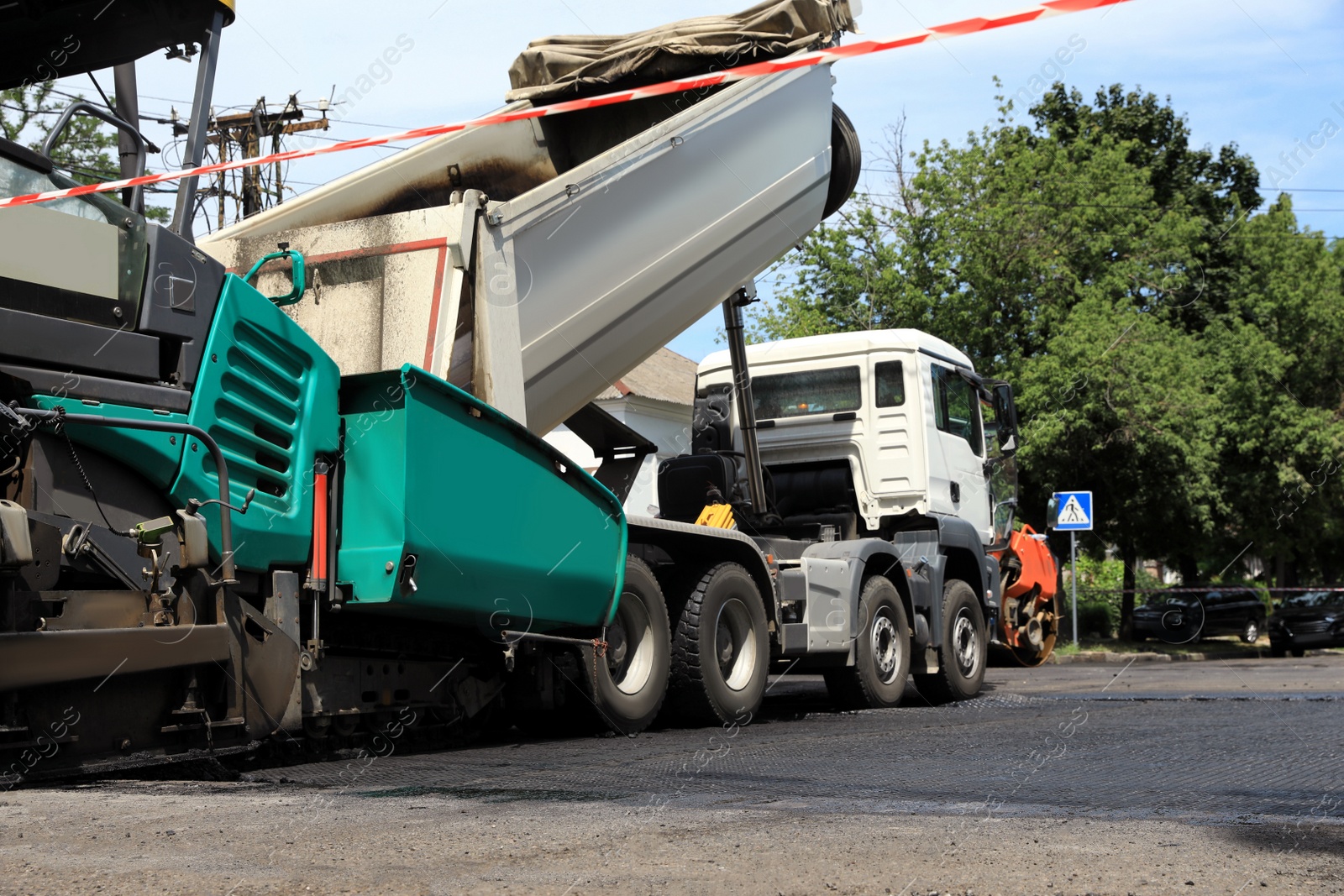 Photo of Road repair machinery working on city street