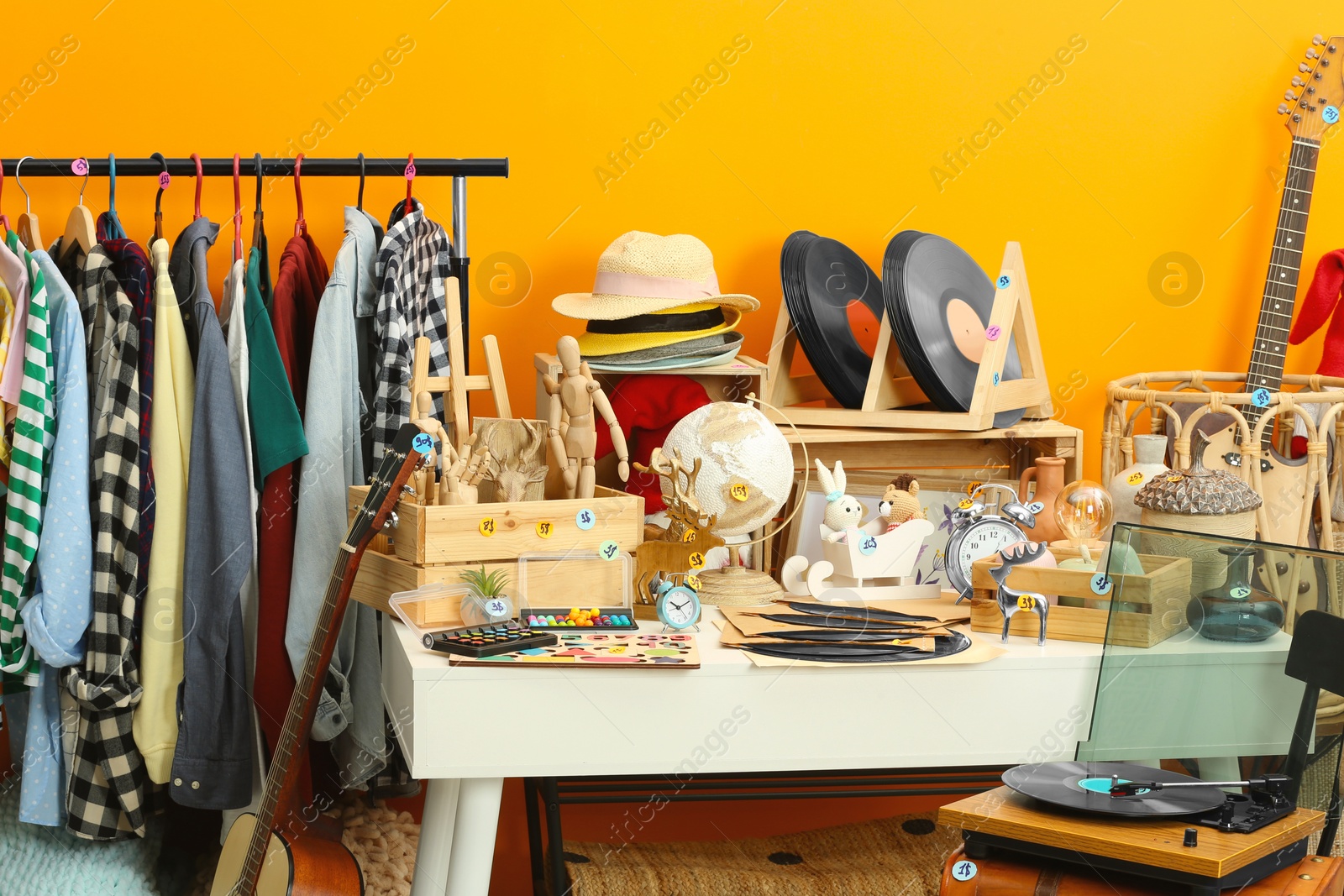 Photo of Many different items in room. Garage sale