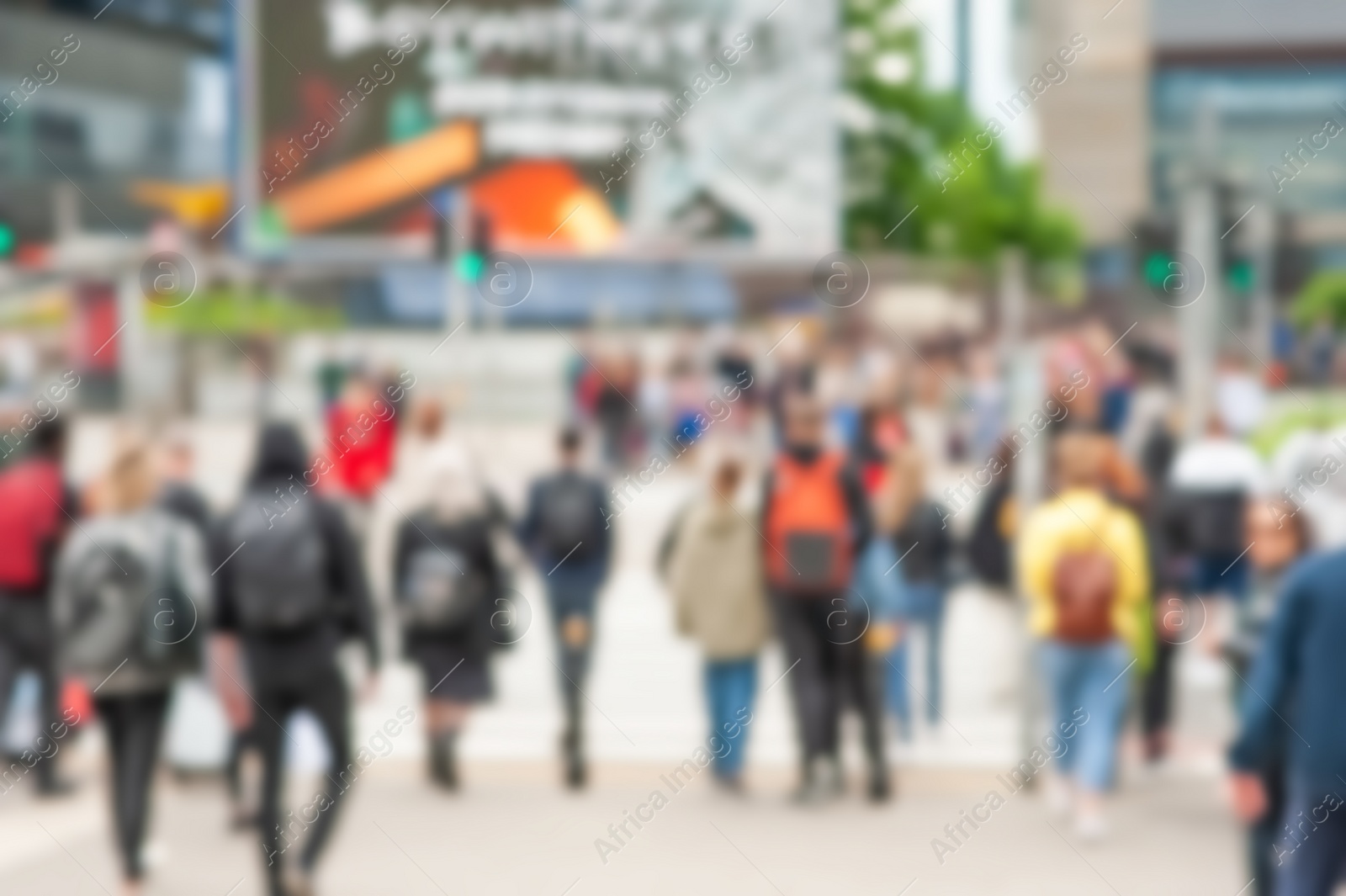 Photo of People crossing street in city, blurred view