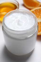 Jar of hand cream on white background, closeup