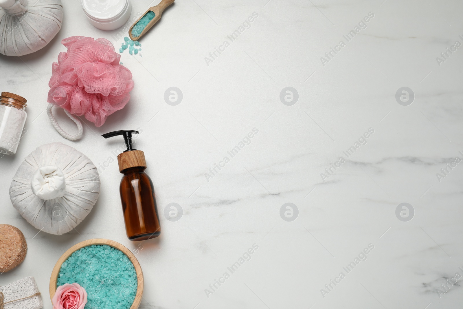 Photo of Flat lay composition of herbal bags and spa products on white marble table. Space for text