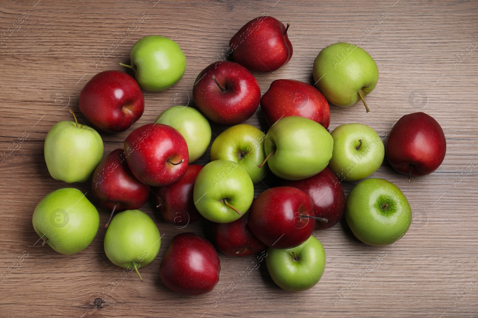 Photo of Fresh ripe red and green apples on wooden table, flat lay