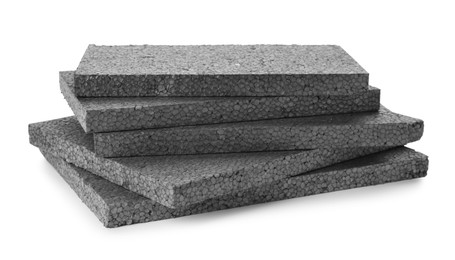 Photo of Stack of grey styrofoam sheets on white background