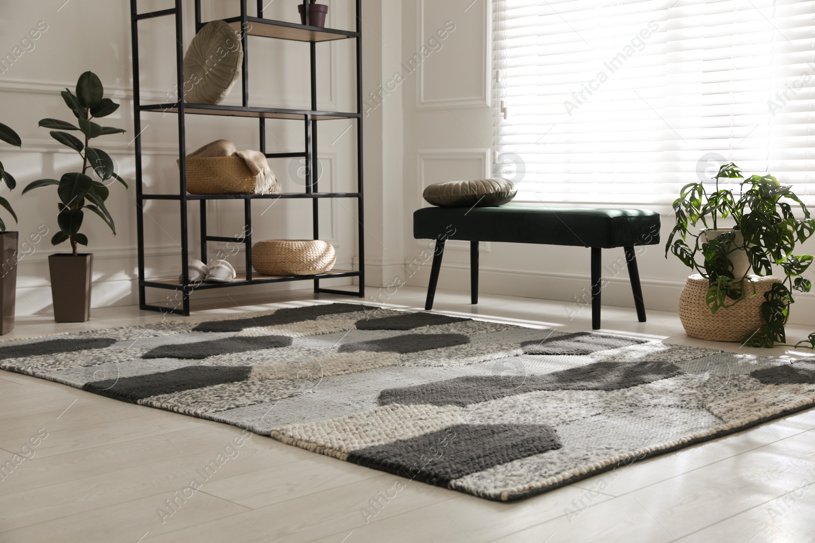 Photo of Stylish carpet with pattern on floor in room