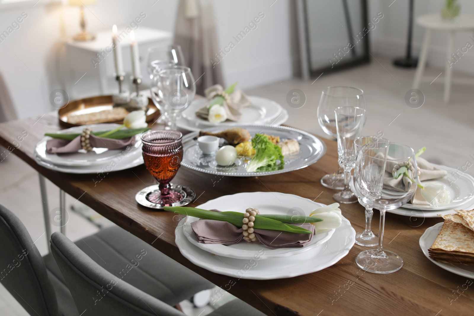 Photo of Festive Passover table setting at home. Pesach celebration