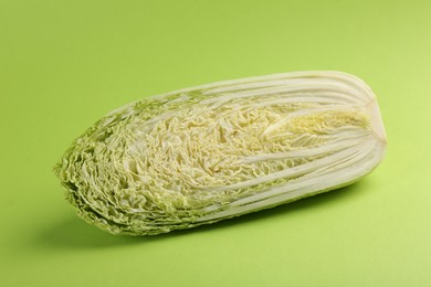 Half of fresh Chinese cabbage on light green background