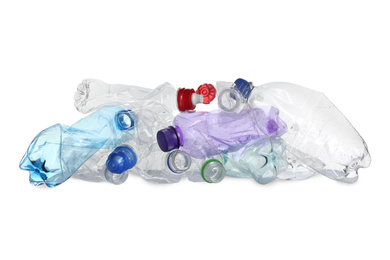 Pile of crumpled bottles isolated on white. Plastic recycling
