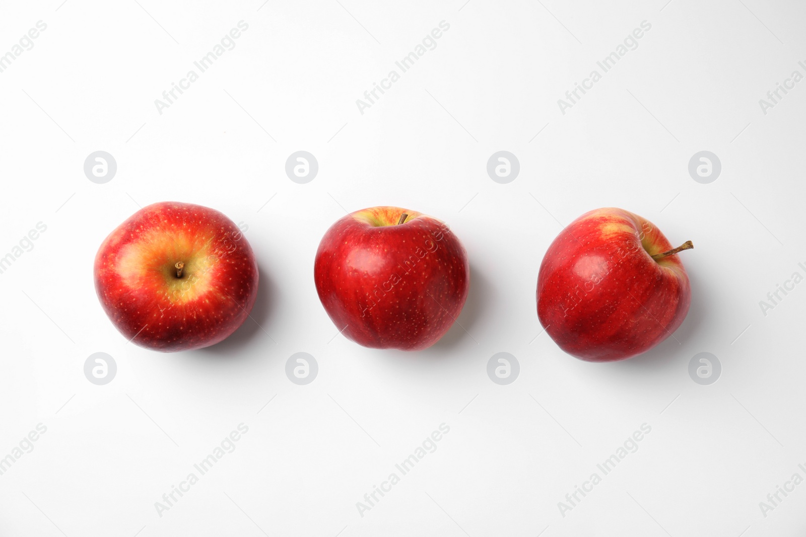 Photo of Fresh ripe red apples on white background, flat lay