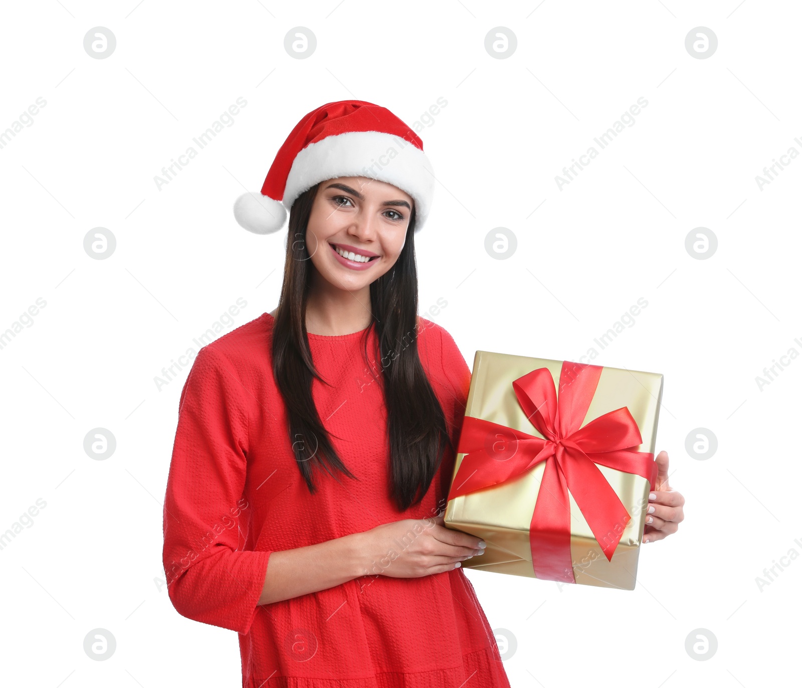 Photo of Happy young woman in Santa hat holding Christmas gift on white background