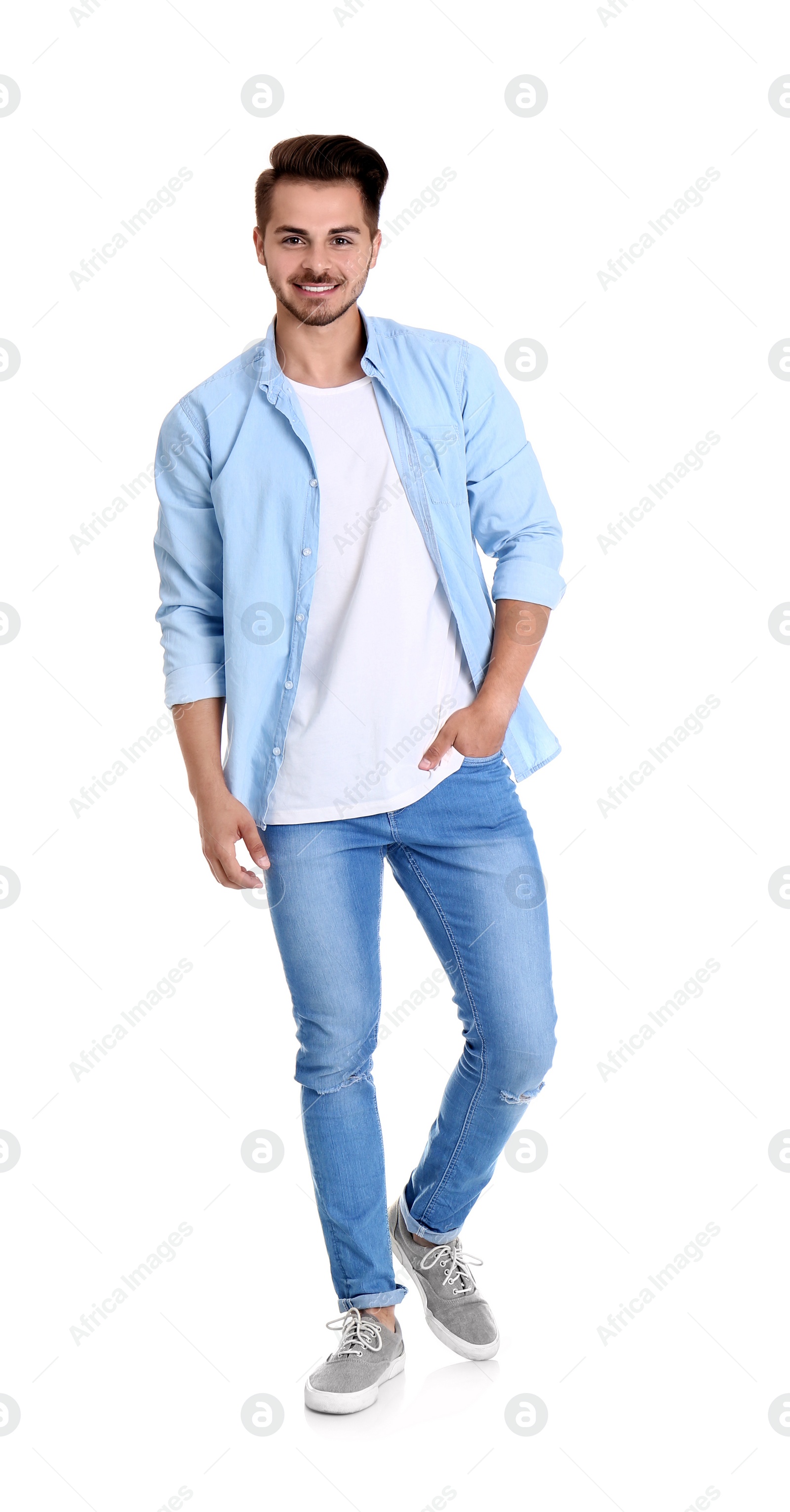 Photo of Young man in stylish jeans on white background