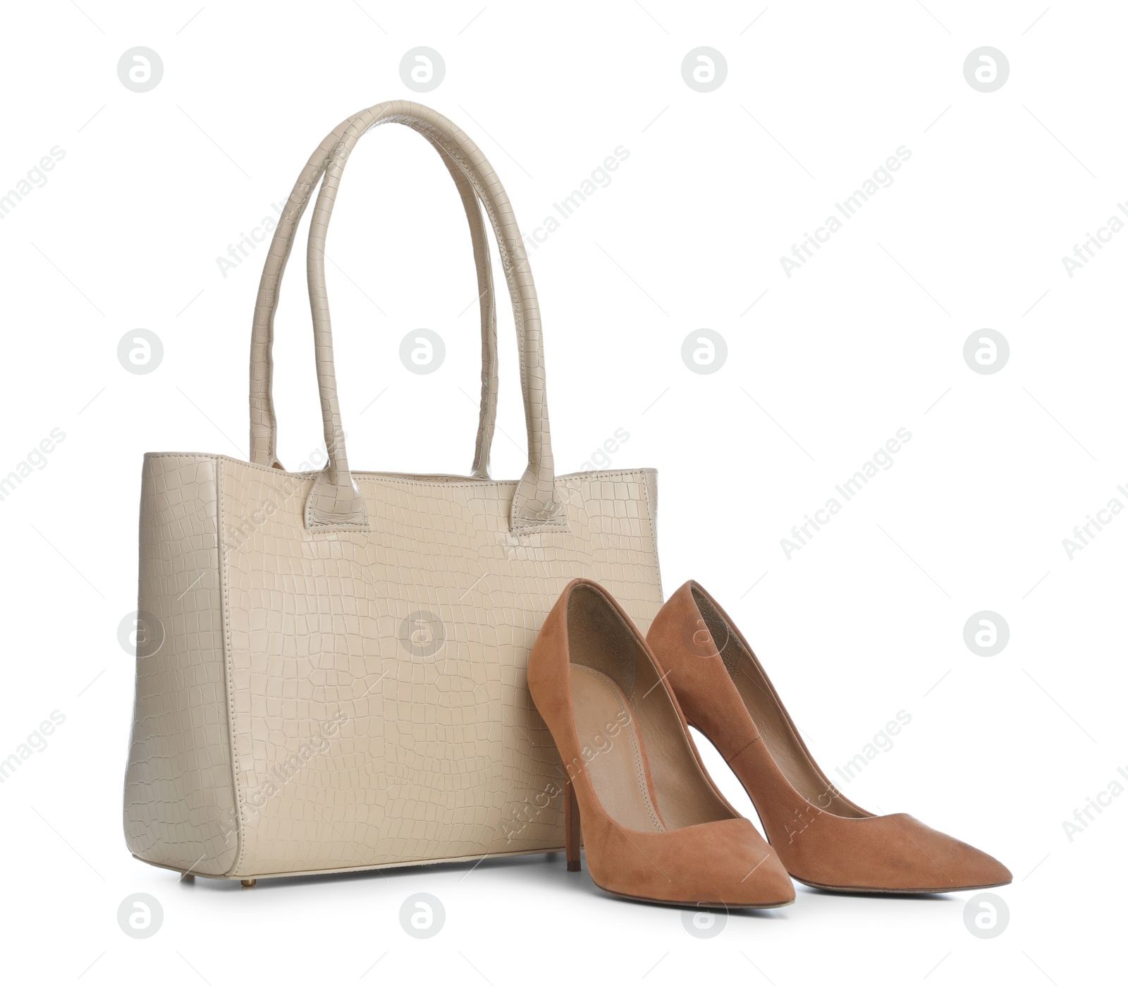 Photo of Stylish woman's bag and shoes isolated on white