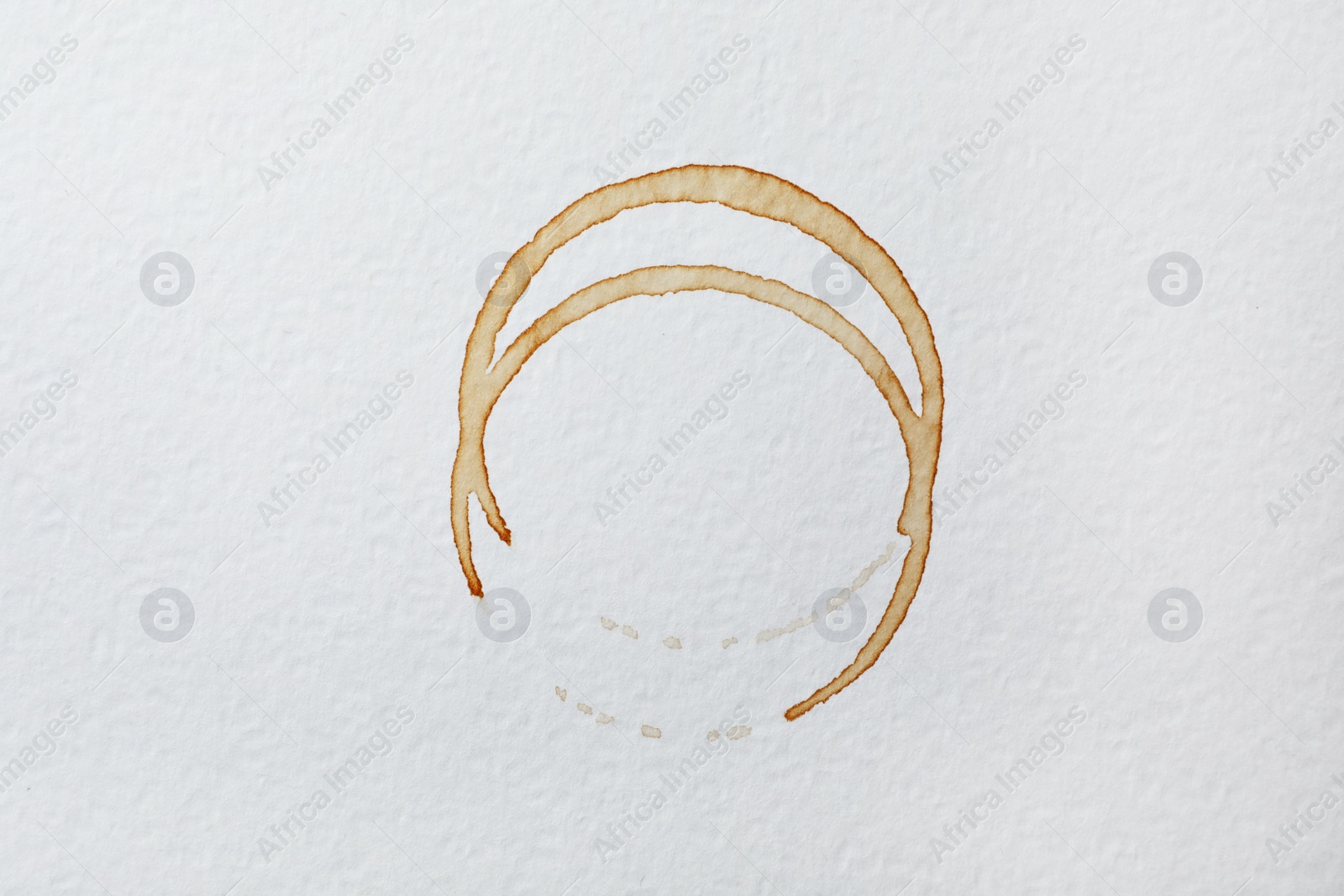 Photo of Dried coffee cup stains on white background, top view