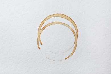 Photo of Dried coffee cup stains on white background, top view