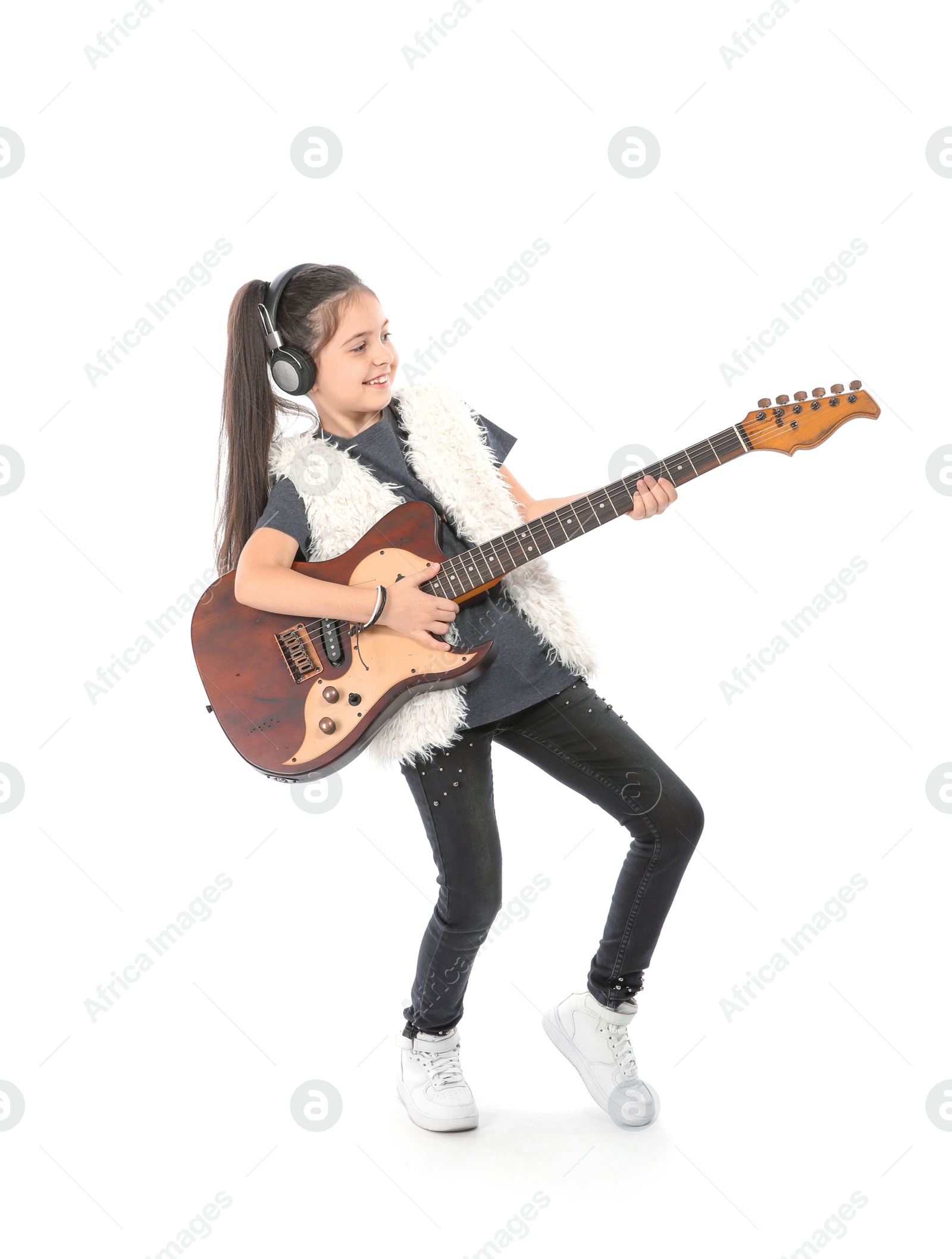 Photo of Emotional little girl playing guitar, isolated on white