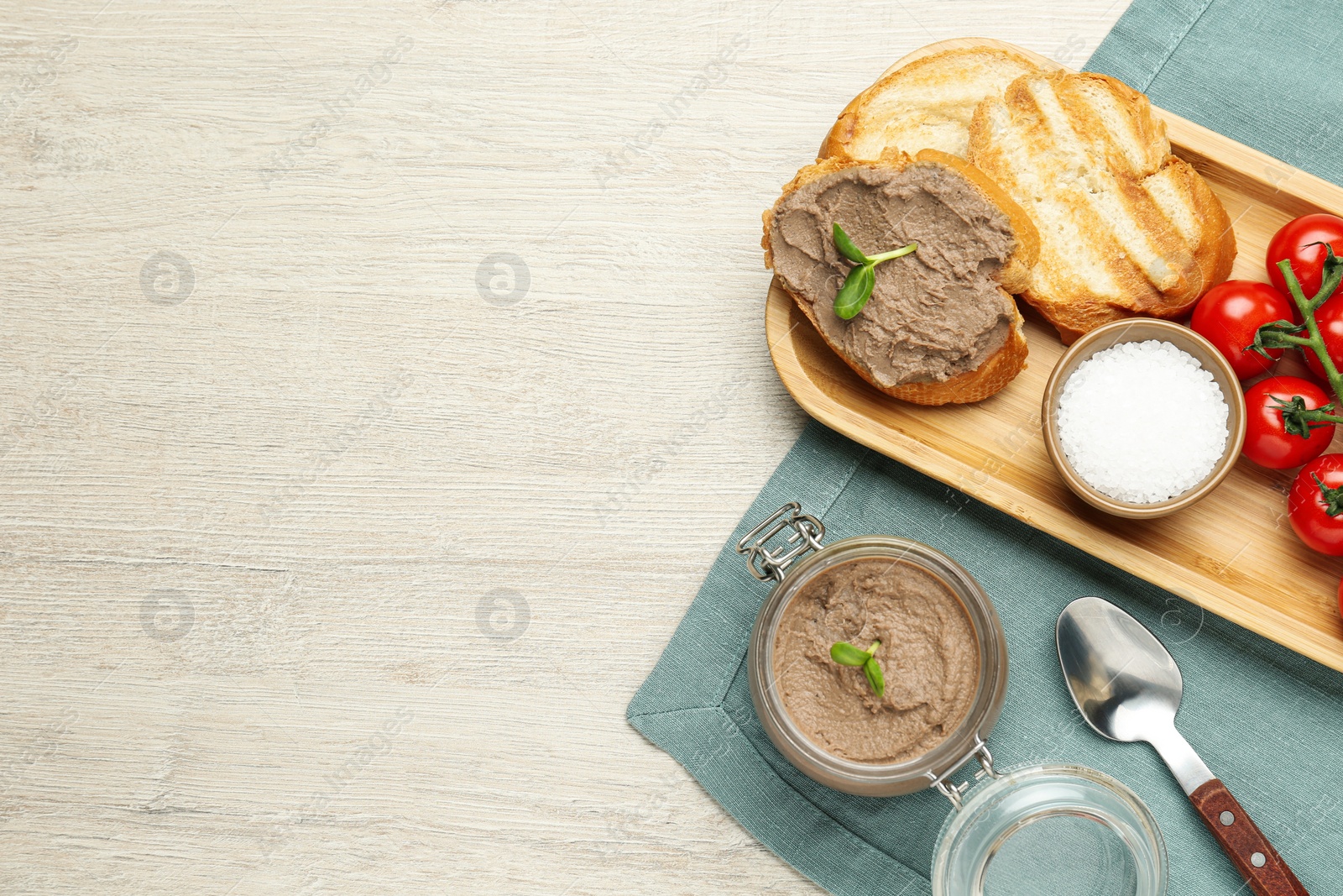 Photo of Flat lay composition with delicious liver pate on white wooden table, space for text