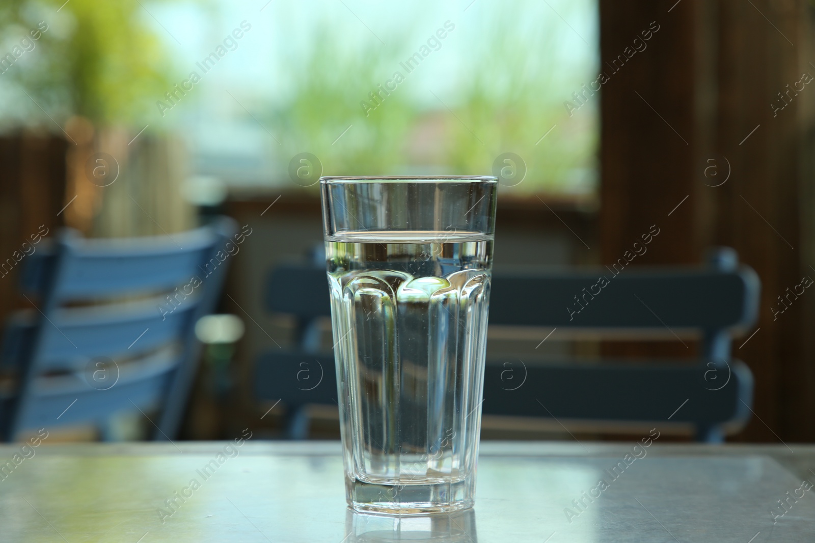 Photo of Glass of fresh water on table indoors