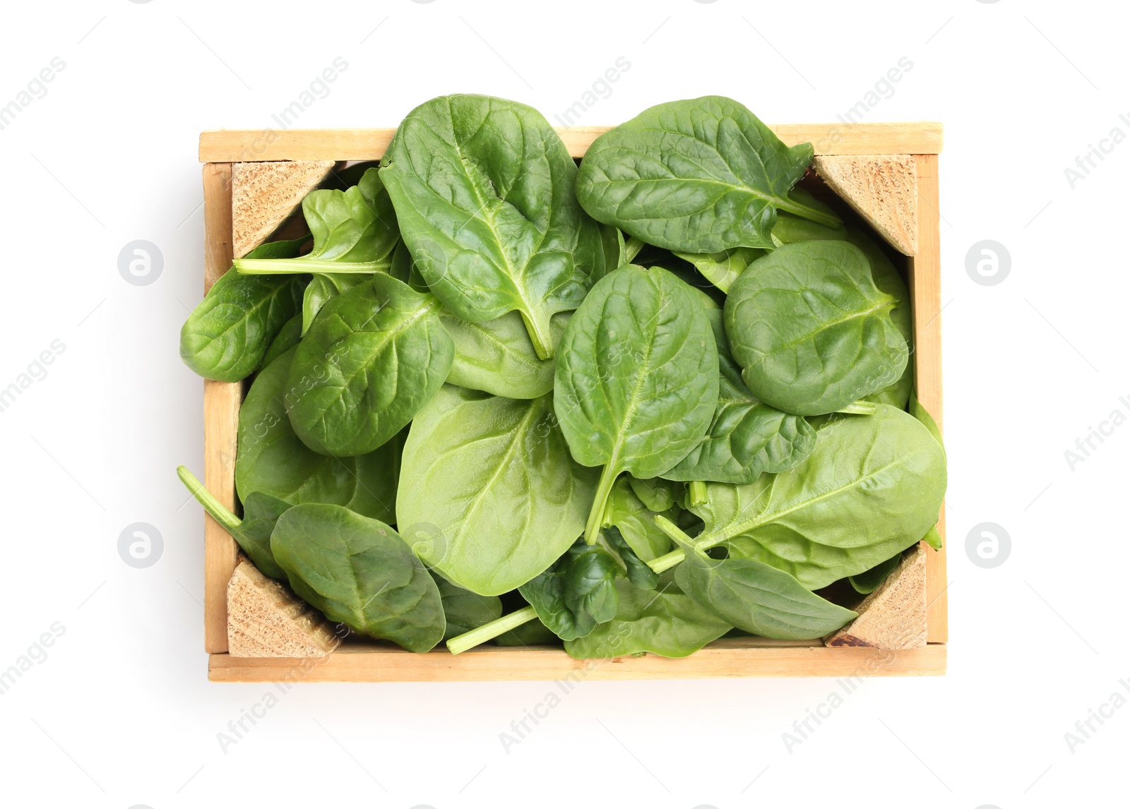 Photo of Crate of spinach leaves isolated on white, top view