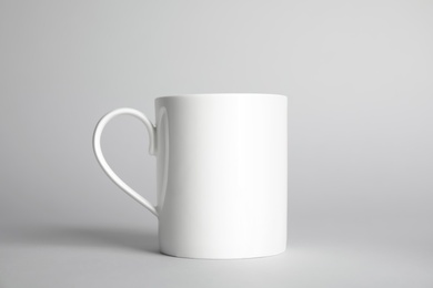 Photo of Ceramic cup on light background. Mock up for design