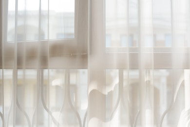 Photo of Window behind white curtain indoors in morning
